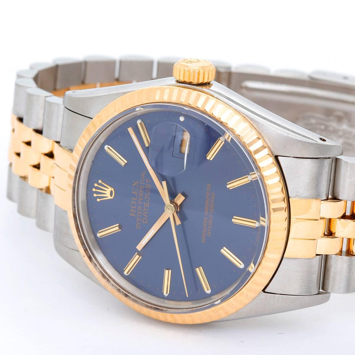 Rolex Datejust Men's 2-Tone Watch 16013 -  Automatic winding, 27 jewels, Quickset, acrylic crystal. Stainless steel case with 18k yellow gold fluted bezel (36mm diameter). Blue dial with gold stick markers. Stainless steel and 18k yellow gold