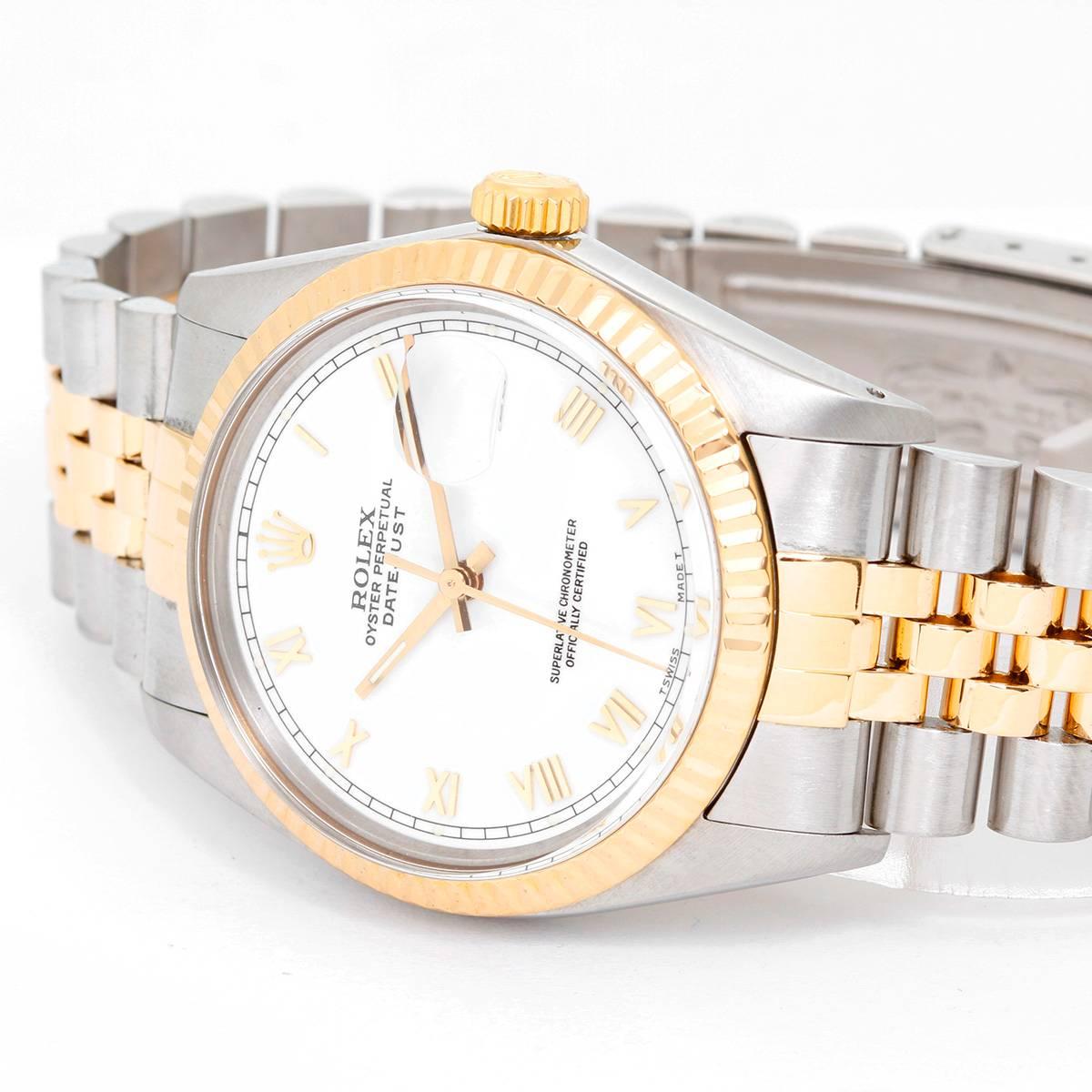 Rolex Datejust Men's 2-Tone Watch 16013 -  Automatic winding, 27 jewels, Quickset, acrylic crystal. Stainless steel case with 18k yellow gold fluted bezel (36mm diameter). White dial with gold Roman numerals. Stainless steel and 18k yellow gold