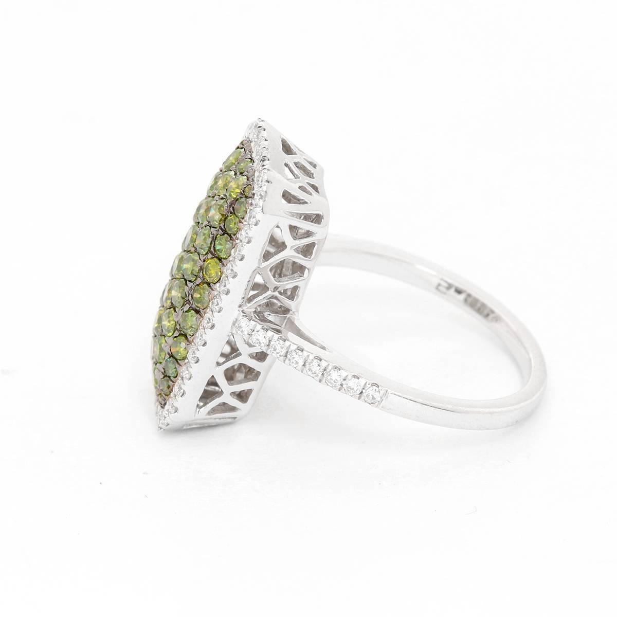 Green Pave Diamond Ring with White Diamond Halo Size - . Emerald shaped Pave green Diamonds. 1.2 cts treated green diamonds set in 14K White gold ring with rhodium accents. Surrounded  by .43 cts of white diamonds.