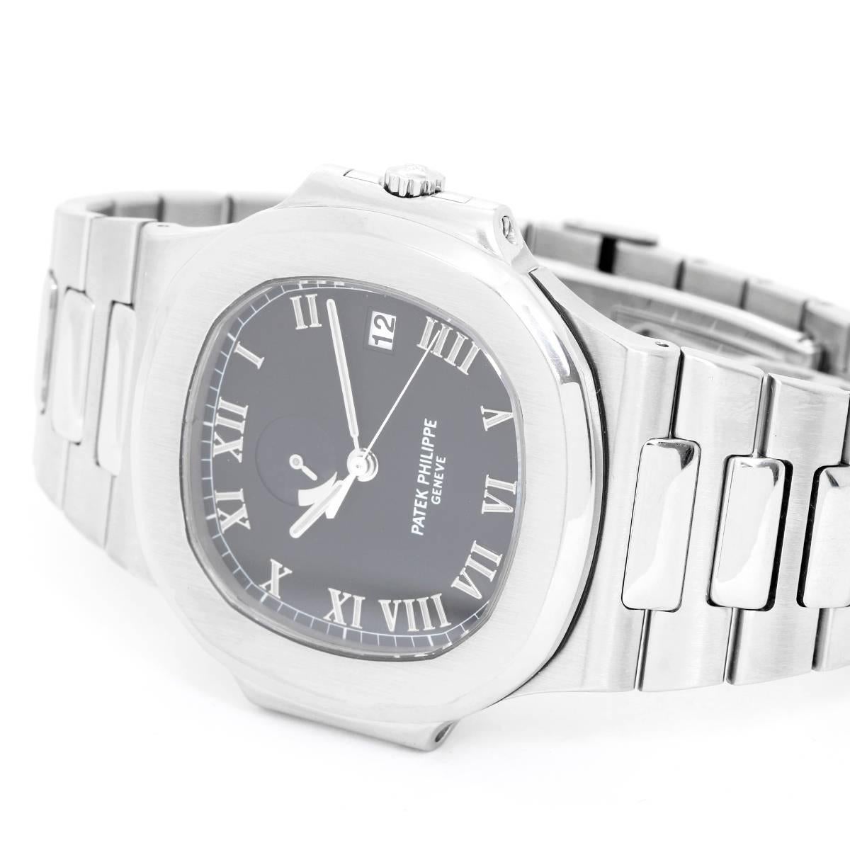 Patek Philippe & Co. Nautilus Stainless Steel Watch Ref 3710 -  Automatic with a 48 hour power reserve. Stainless Steel ( 41 mm  x 45 mm ). Black dial with raised Roman numerals; date at 3:00 o'clock. Stainless steel Nautilus bracelet. Pre-owned