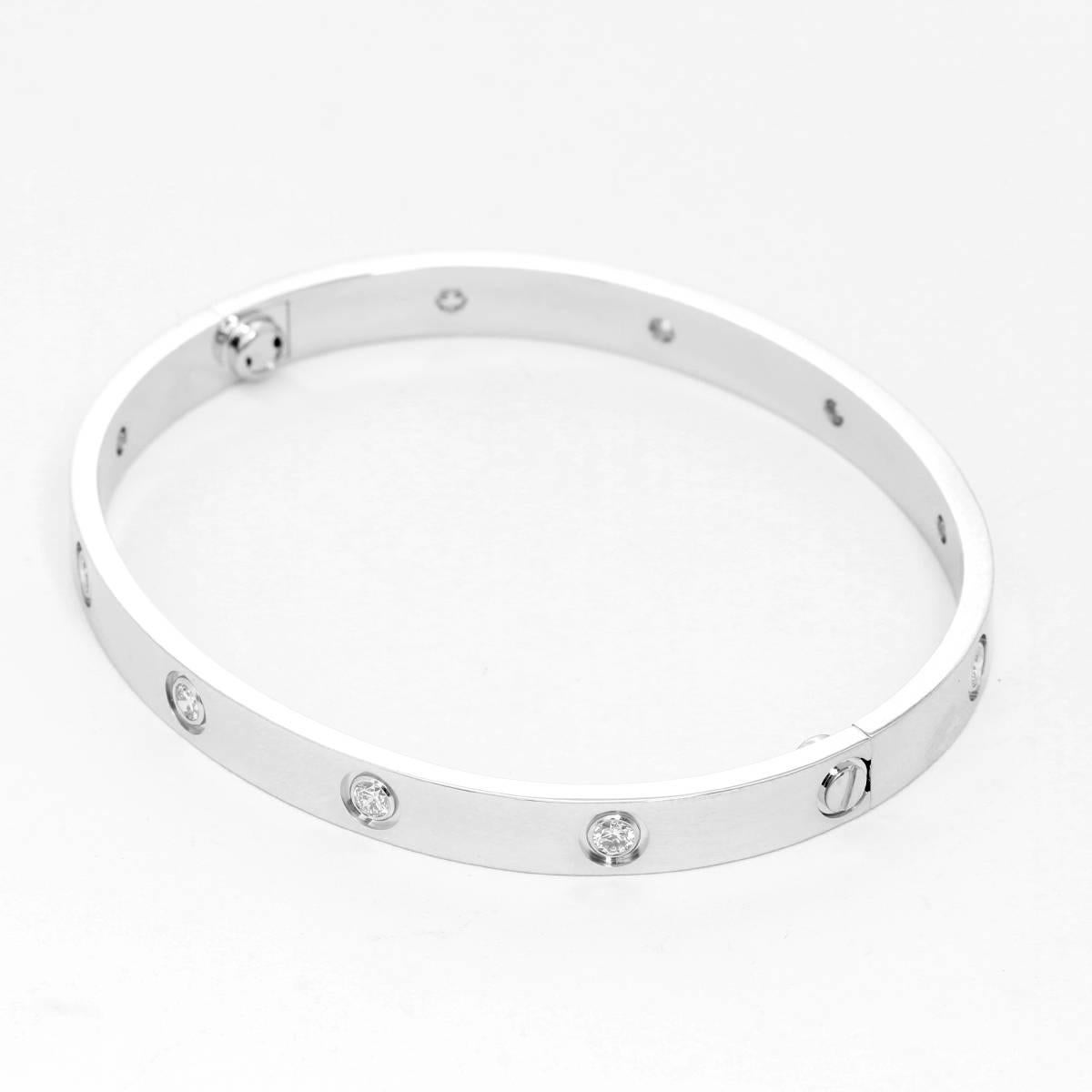Cartier 18K White Gold Diamond Love Bracelet size 19 - . 18K White Gold set with 10 brilliant-cut diamonds totaling .96 cts. Hallmarks CARTIER, AWZ531, AU705. New screw system which makes taking it off much easier. Pre-owned with Cartier box and