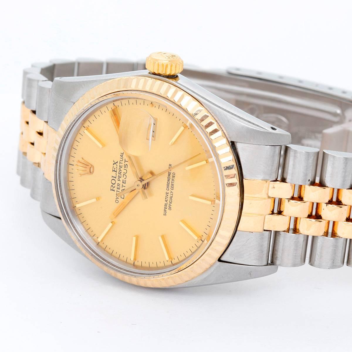 Men's Rolex Datejust 2-Tone Watch 16013 -  Automatic winding, 27 jewels, Quickset, acrylic crystal. Stainless steel and 18k yellow gold fluted bezel  (36mm diameter). Champagne dial with stick markers. Stainless steel and 18k yellow gold Jubilee