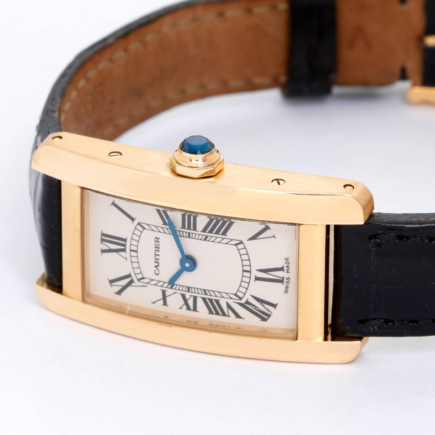 Cartier Tank Americaine Ladies 18k Yellow Gold Watch -  Quartz. 18k yellow gold case (19mm x 35mm). Ivory colored dial with black Roman numerals. 18K yellow gold Cartier bracelet will accommodate up to a 6.5 inch wrist. Pre-owned with box.