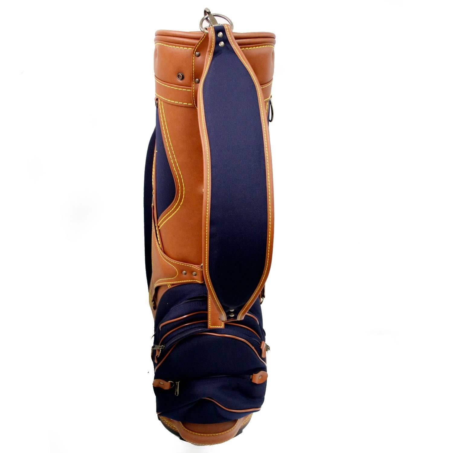 Patek Philippe & Co. Golf Bag - . Original blue and with brown leather accents. Six full -length dividers for organization and separation of clubs. Three pockets for side garments. Top dimensions: 12 x 11 x 35 inches. Total weight 10 lbs.