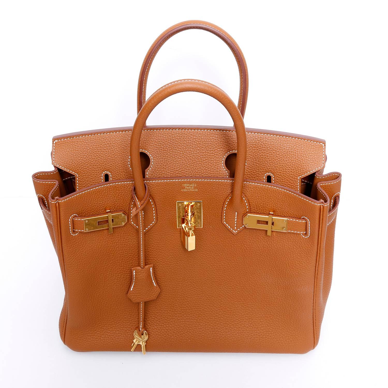  Hermes Togo Gold Birkin 30 - 2016 - . Beautiful Togo gold leather from the 2016 collection with gold hardware. Chevre leather lining, dual pockets inside. Stamped X from 2016. Size 30 cm. Light new. Carried twice. No rubbing on handle, impeccable