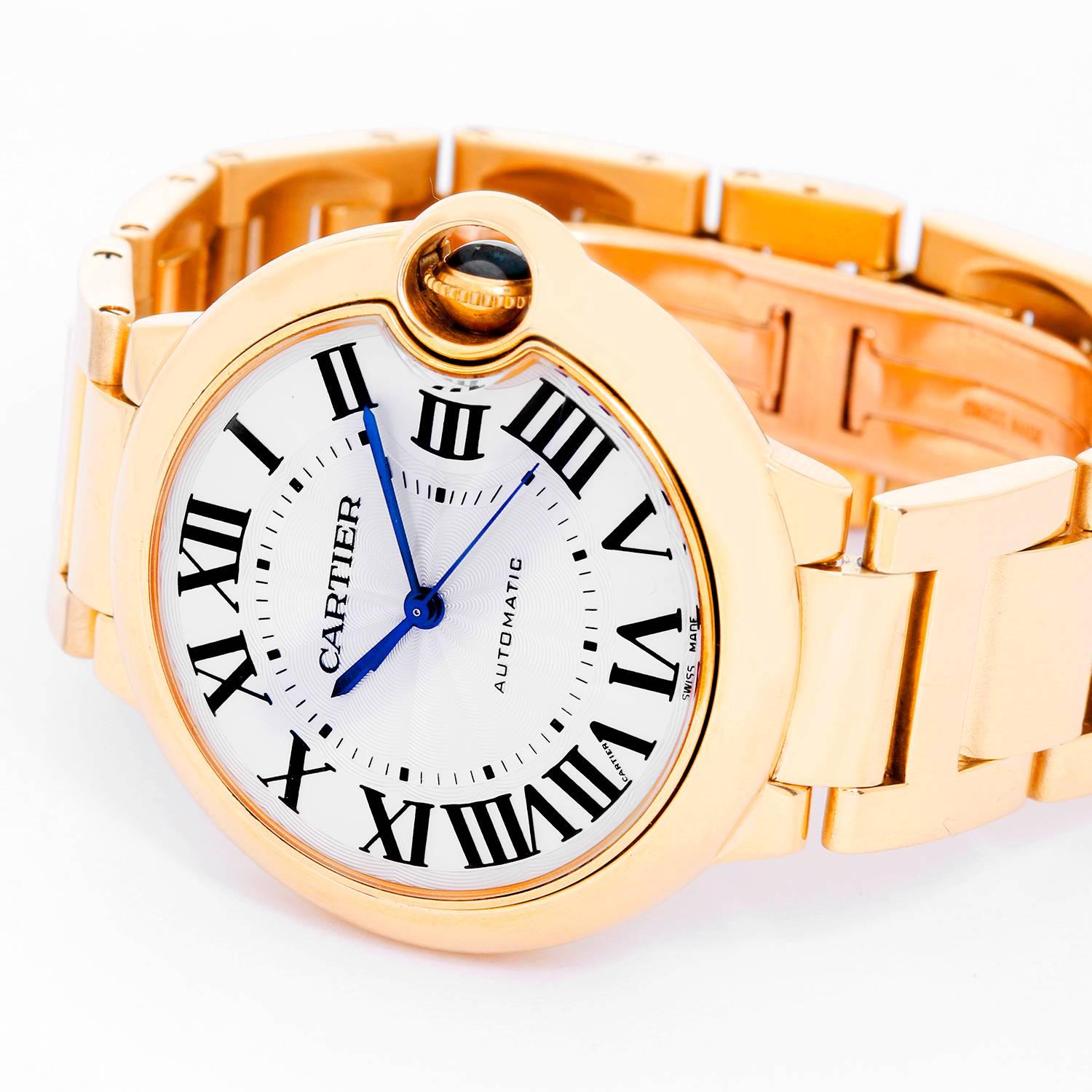 Cartier Ballon Bleu Midsize 18k Yellow Gold Watch W69003Z2 -  Automatic winding. 18k yellow gold case (36mm). Silver guilloche dial with black Roman numerals. 18k yellow gold Cartier bracelet with deployant clasp. Pre-owned with box and books.