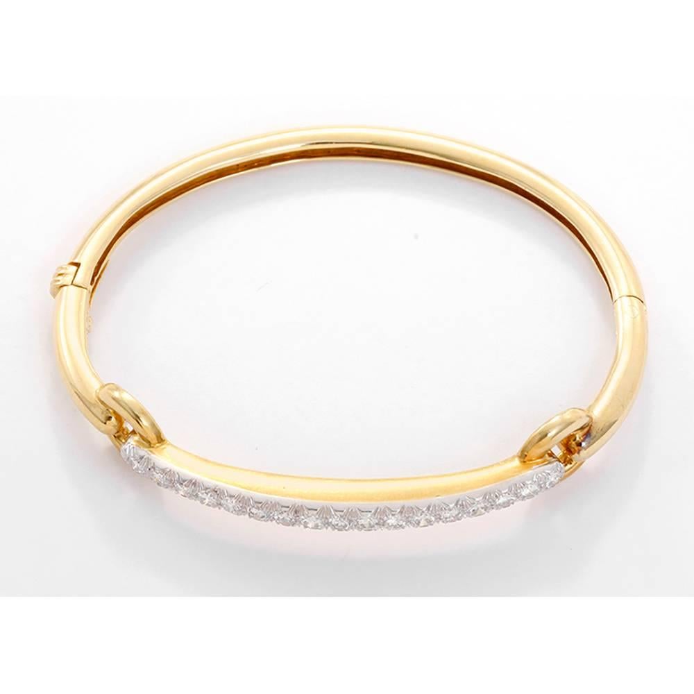 Rare Vintage Signed David Webb Ladies Diamond 18k Gold & Platinum Bangle Bracelet - . Beautiful oval shaped bangle. 18k yellow gold with 17 round brilliant cut diamonds set in platinum.  Apx. 1.70 ctw. Total weight of the bracelet is 18.6 grams.