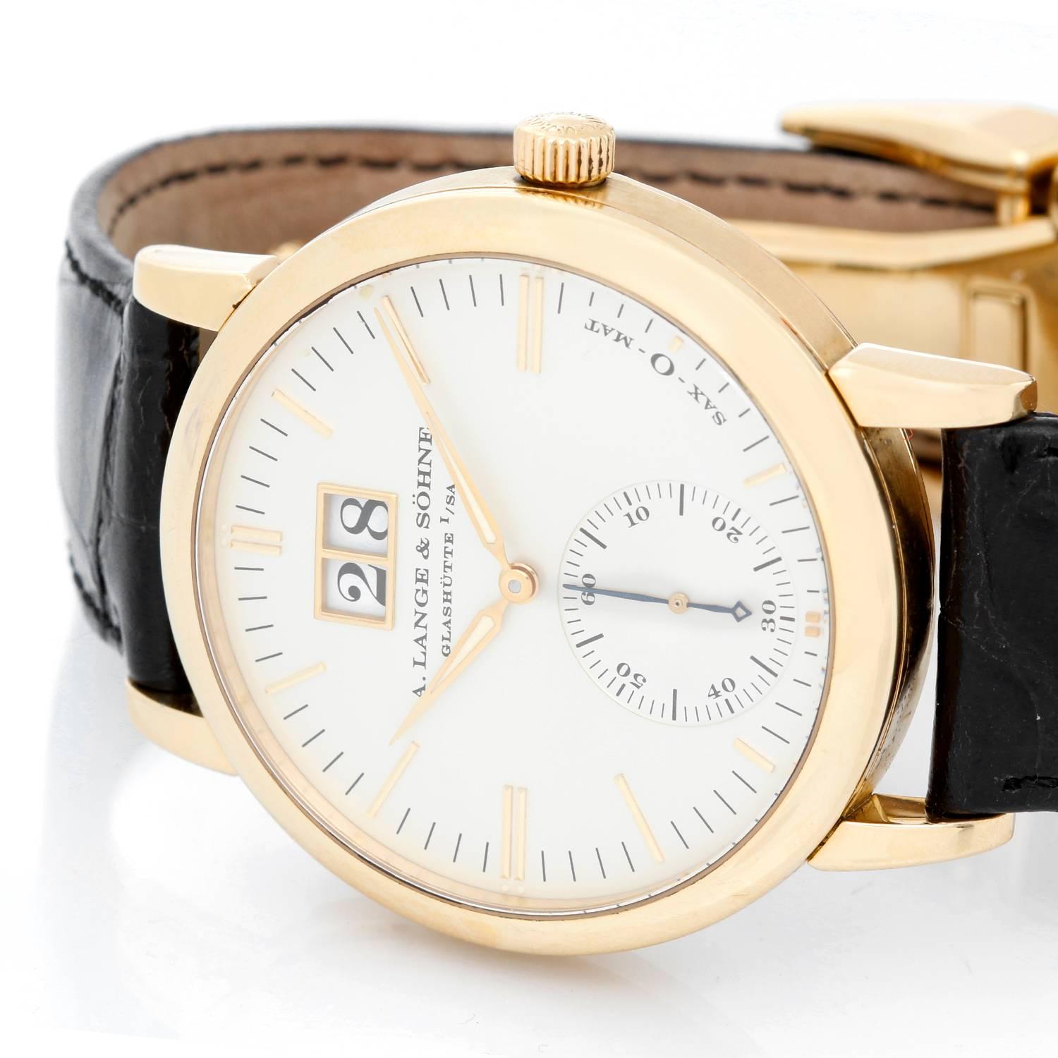 A. Lange & Sohne Langematik 18K yellow Gold Men's Watch -  Automatic. 18K Yellow Gold with exposition back ( 37 mm ). Silvered dial with yellow gold hour markers. Black alligator strap with 18K Yellow Gold A. Lange & Sohne deployant clasp.