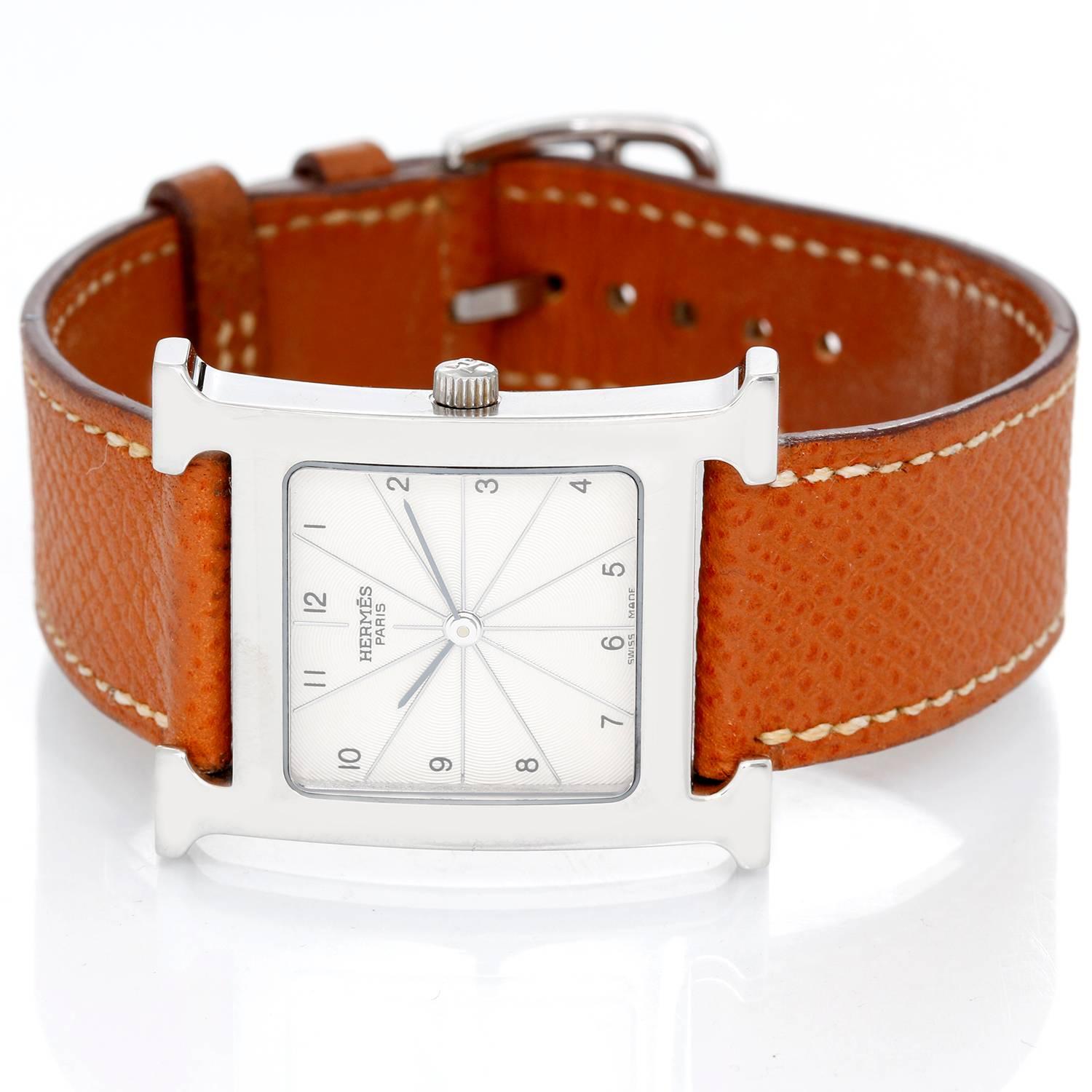 Hermes Heure H Ladies Watch -  Quartz. Stainless Steel ( 26 mm x 26 mm ). Ivory Guilloche dial with Arabic numerals. Brown leather strap. Pre-owned with custom box.