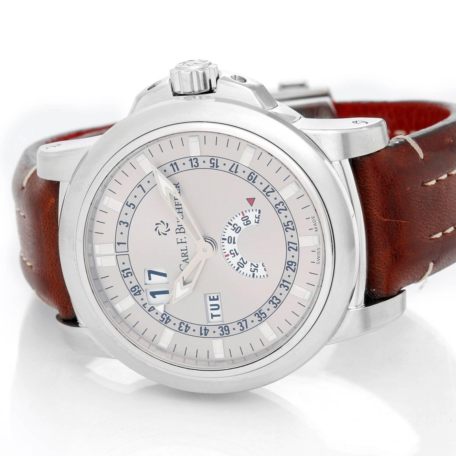 Carl F. Bucherer Patravi Calendar Stainless Steel Men's Watch -  Automatic. Stainless Steel ( 42.6 mm ). Silvered dial with Sub dial at 6 o'clock. Brown leather calf skin with white stitching. Pre-owned with Carl F. Bucherer box and books.