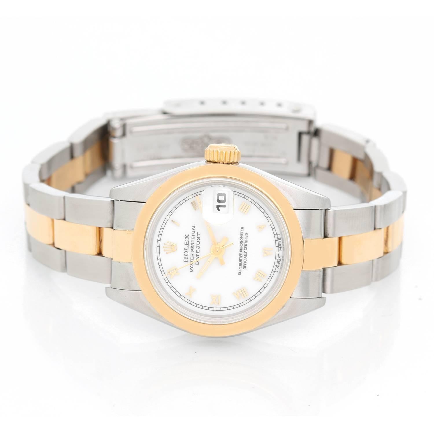 Rolex Datejust 2-Tone Ladies Watch 69173 -  Automatic winding, 29 jewels, Quickset date, sapphire crystal. Stainless steel case with smooth bezel (26mm diameter). White dial with Roman numerals. Stainless steel and 18k yellow gold oyster bracelet.
