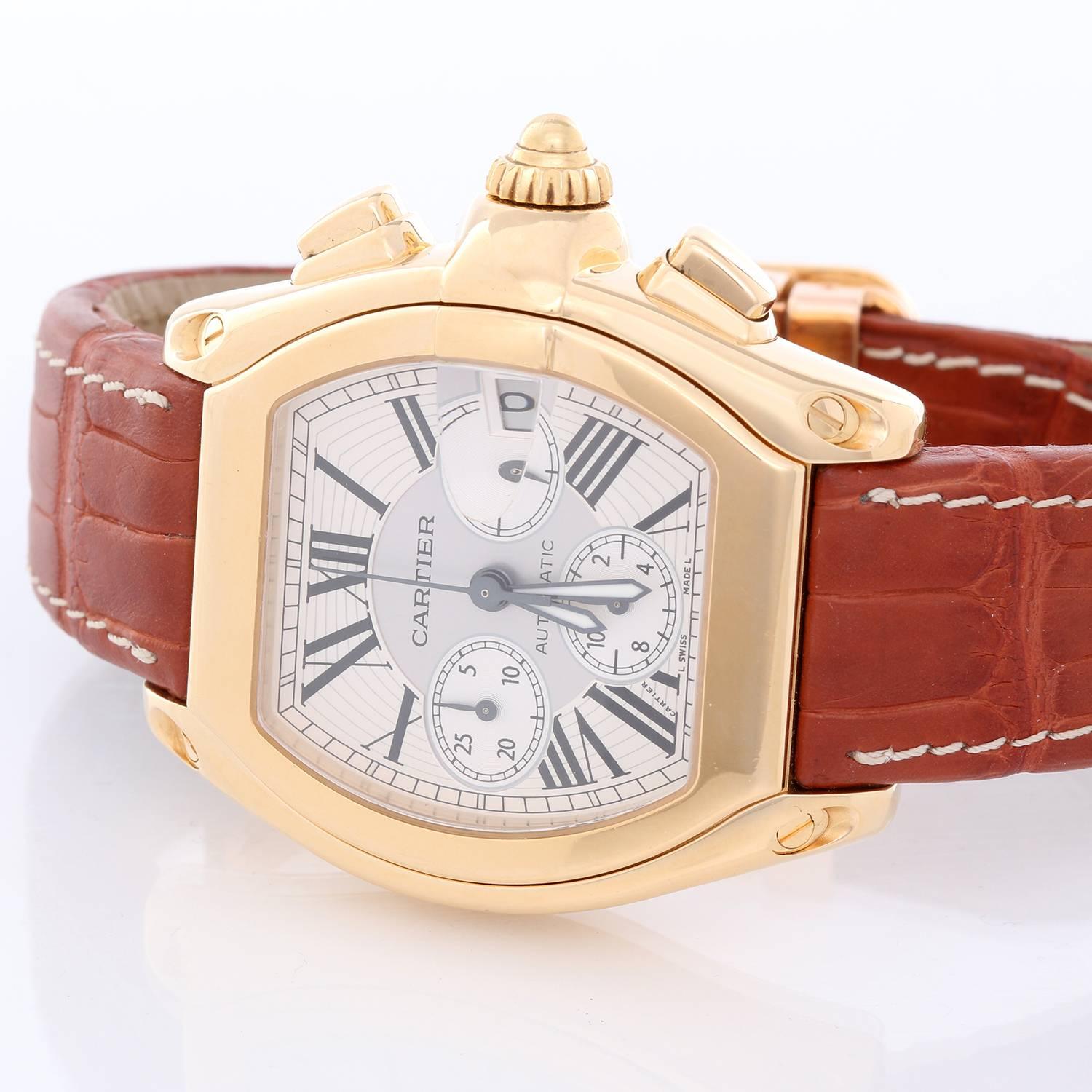 Cartier Roadster XL Chronograph 18k Yellow Gold Men's Watch W62021Y3 -  Automatic winding; chronograph with date. 18k yellow gold case (43 mm x 47mm). Two-tone silver dial with black Roman numerals. Cartier strap band with 18k yellow gold deployant