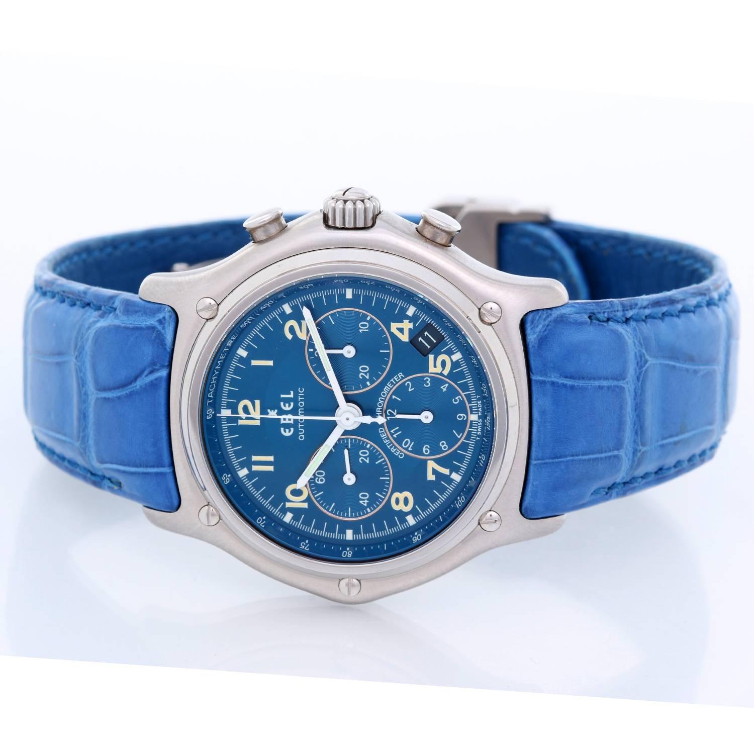 Ebel Stainless Steel  1911 Men's Watch -  Automatic. Stainless Steel ( 40 mm ). Silvered blue dial with  tachymeter track; 3 sub dials with Arabic numerals. Blue alligator strap with deployant clasp. Pre-owned with custom box.