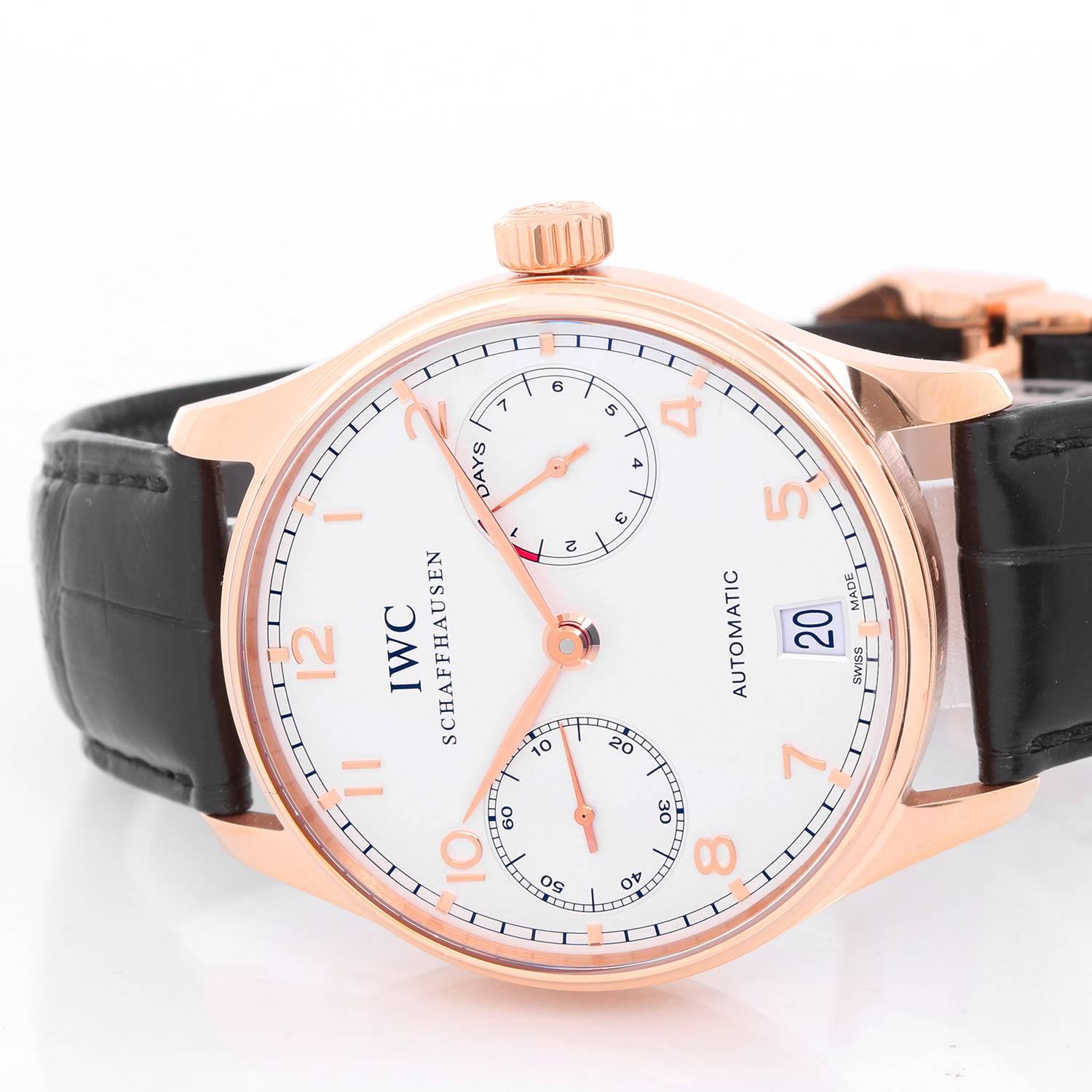 IWC Portuguese 7 Day Power Reserve 18K Rose Gold Men's Watch Ref 5001 - 01 -  Automatic winding. 18K Rose Gold (43 mm). Silvered dial with raised gold Arabic numerals. Black leather strap with 18K Rose Gold IWC deployant clasp. Pre-owned with IWC