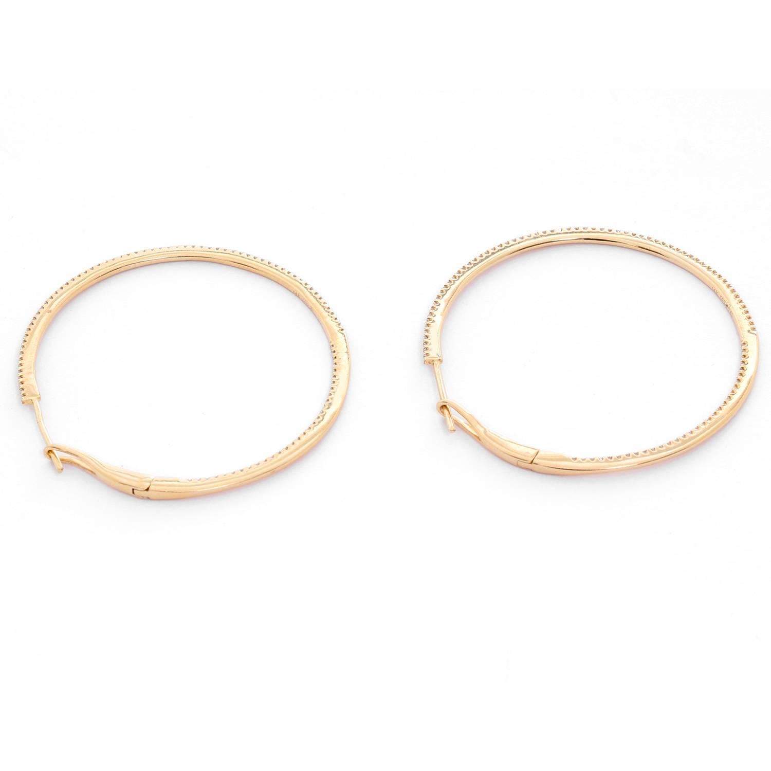 14K Yellow Gold Round Inside Out Hoops - . Stunning and delicate 14K Yellow Gold hoops. Measuring 1 1/2  in. in diameter with .55 cts of diamonds. Clarity SI. Color GH. Total weight 6 grams.