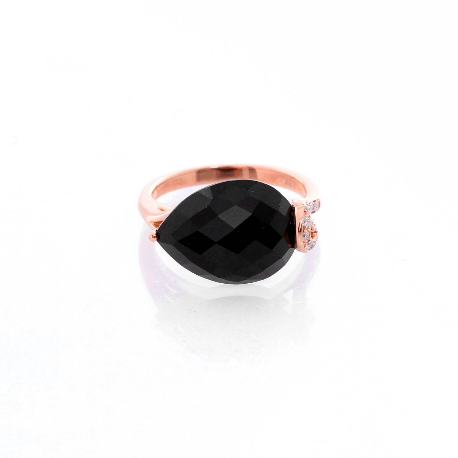 Onyx and Diamond Rose Gold Ring Size 7.5 - . This amazing ring features a tear drop black Onyx stone measuring 9.20 cts.  On a Rose Gold setting with .14cts of diamonds. Total weight 4.8 grams. Size 7.5 ( Sizeable )