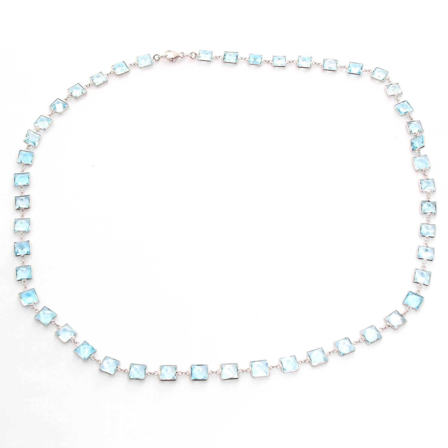 Stunning 14K White Gold Blue Topaz by the Yard Necklace - .  14K White Gold with Square Blue Topaz stones. Length 20 inches. Total weight 16.9 grams. Perfect to wear with an every day outfit or a night outfit.
