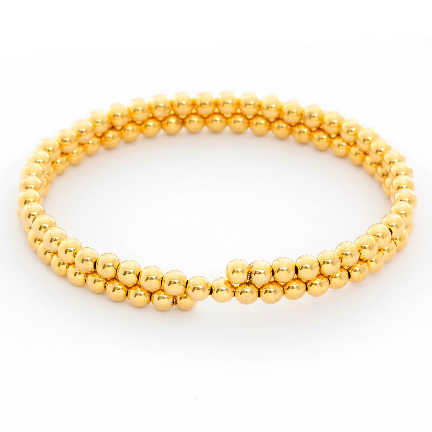 14K Yellow Gold Beaded Double Strand Wrap Bracelet  - 4mm Yellow Gold beads make up this cuff bracelet with two strands. Bracelet measures 6.5 inches but has some stretch. New with DeMesy box. 