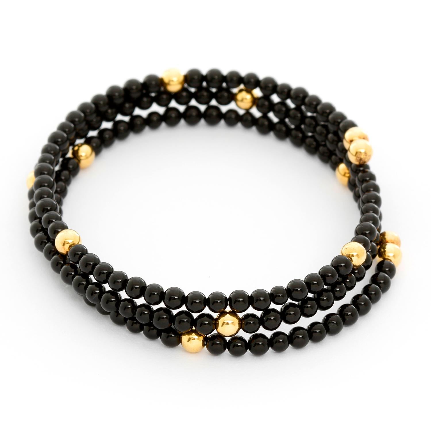Black Onyx Beaded Bangle Bracelet  - Wrap cuff bracelet with 3 strands of 3mm black onyx beads and 4mm gold accent beads.Bracelet measures 6.5 inches but offers stretch. New with DeMesy box.