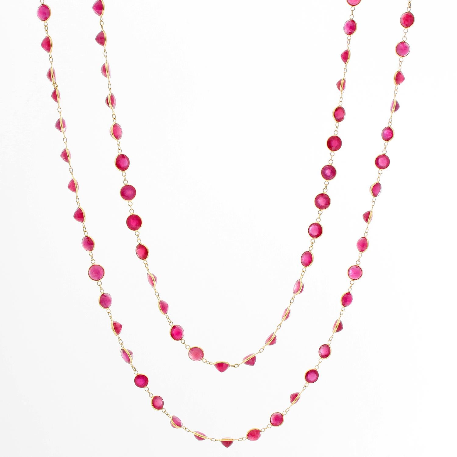 Stunning Ruby and 18K Yellow Gold Necklace - 90 round Rubies are housed on an 18k yellow gold necklace, 3 round links separate each ruby, making this necklace 19 inches long and weighing 25 grams. New with DeMesy box.