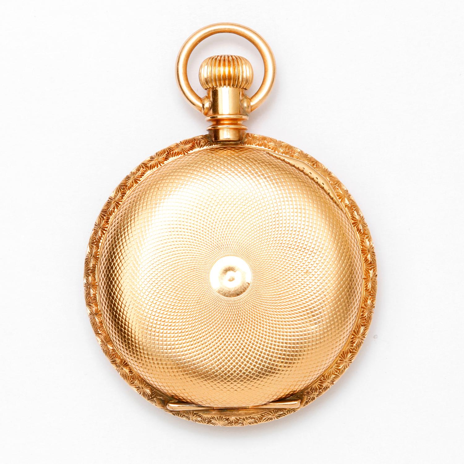 Vintage Elgin Pocket Watch 14K Yellow Gold Pocket Watch  - Manual winding ( 37 mm ) . 14K Yellow gold with coin edged. Front and back of case are intricately engraved with a floral botanical design around the engine turned design in the center.