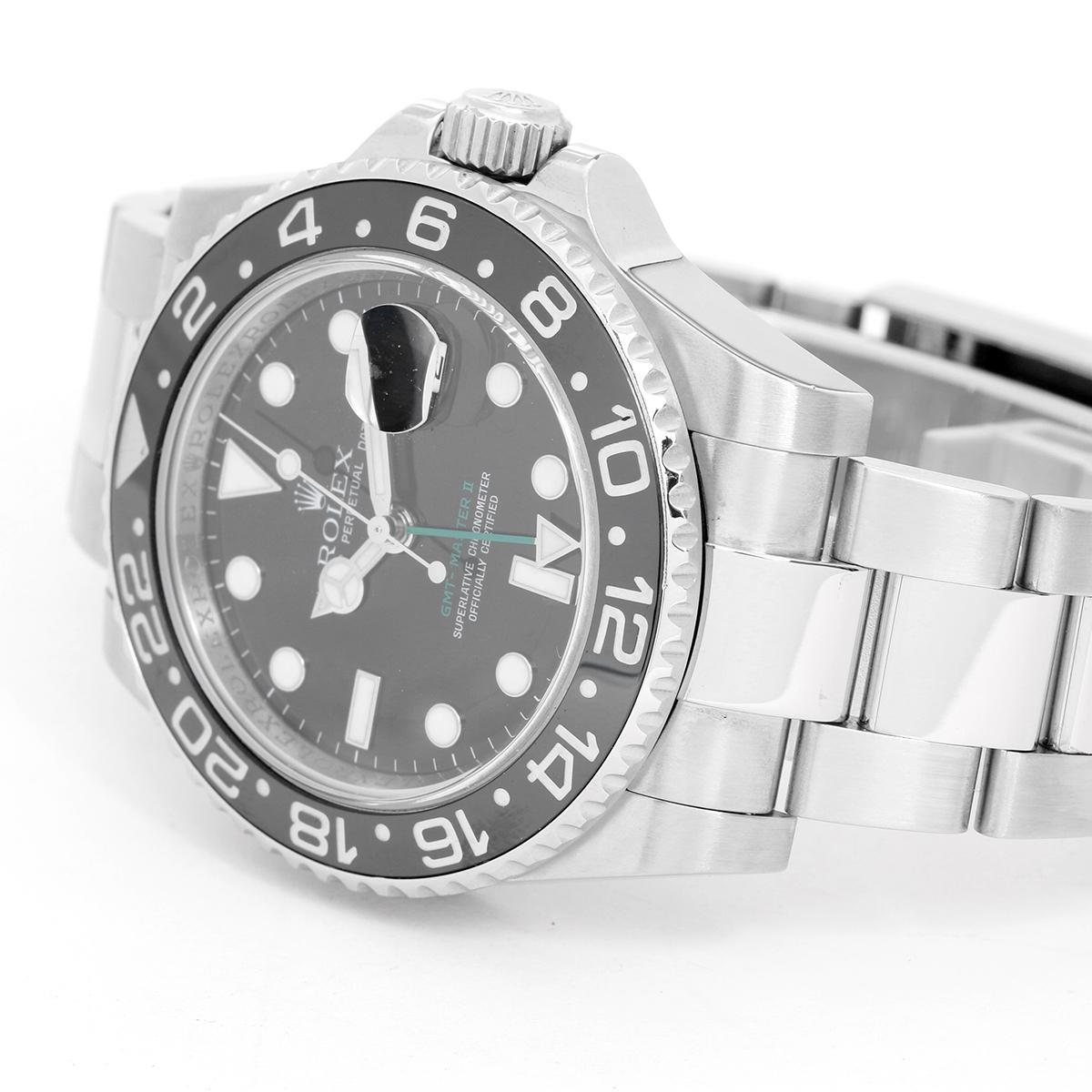 Men's Rolex GMT-Master II Watch 116710 ( 116710N ) - Automatic winding, 31 jewels. Stainless steel case with 24 hour ceramic bezel  ( 40 mm ) . Black dial with luminous markers; green GMT hand. Stainless steel Oyster bracelet with flip-lock clasp.