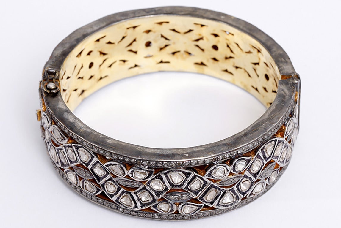 These beautiful bangles are the rage right now and a lot of bang for a low price. They were made in India and are of oxidized sterling silver and 14k yellow gold with rose cut diamonds. The smaller bangles weigh 22.8 grams each and feature 4 carats