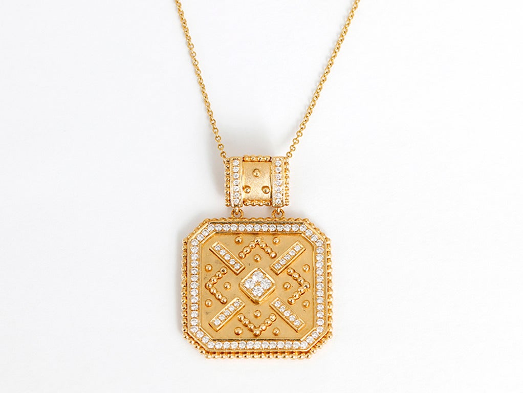 This amazing classic pendant is apx. 7/8-inch square.  It hangs from a beautiful gold and diamond bale that is apx. 1/4-inch in length making the total length of the pendant including the bale apx. 1-1/4 inches. The necklace has 98 diamonds totaling