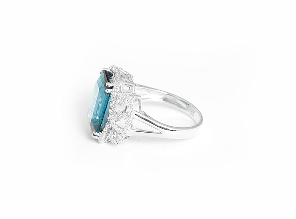 This beautiful ring features an 8.70 carat London blue topaz (10mm x 14mm) and 0.31 carats of diamonds set in 18k white gold. Total weight is 5.7 grams. Size 7-1/2.