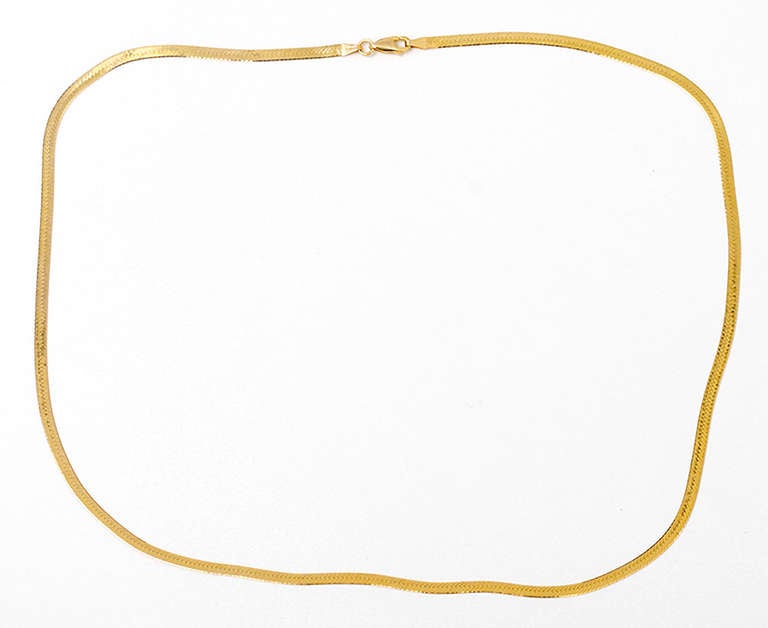 This is a stunning 14k yellow gold snake chain necklace that is light and comfortable!  It is apx. 24 inches in length with a total weight of  8.4 grams.