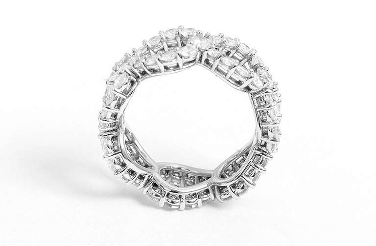 This stunning ring features 63 round brilliant diamonds weighing a total of 3.06 carats; platinum setting. It is a size 7 with a total weight of 8.7 grams.