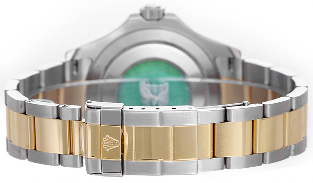 Automatic winding, 31 jewels, Quickset, sapphire crystal. Stainless steel case with 18k yellow gold bezel  (40mm diameter). Factory Rolex Tahitian mother of pearl dial with luminous style markers. Stainless steel and 18k yellow gold Oyster bracelet