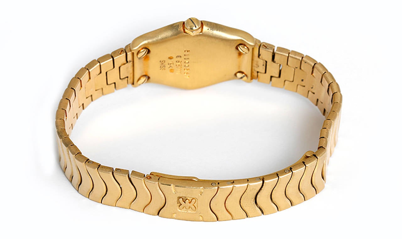 Quartz. 18k yellow gold case and smooth bezel (23mm diameter). Mother of pearl dial with gold Roman numerals. Ebel Wave 18k yellow gold bracelet (will fit apx. 6-in. wrist). Pre-owned with box and papers.