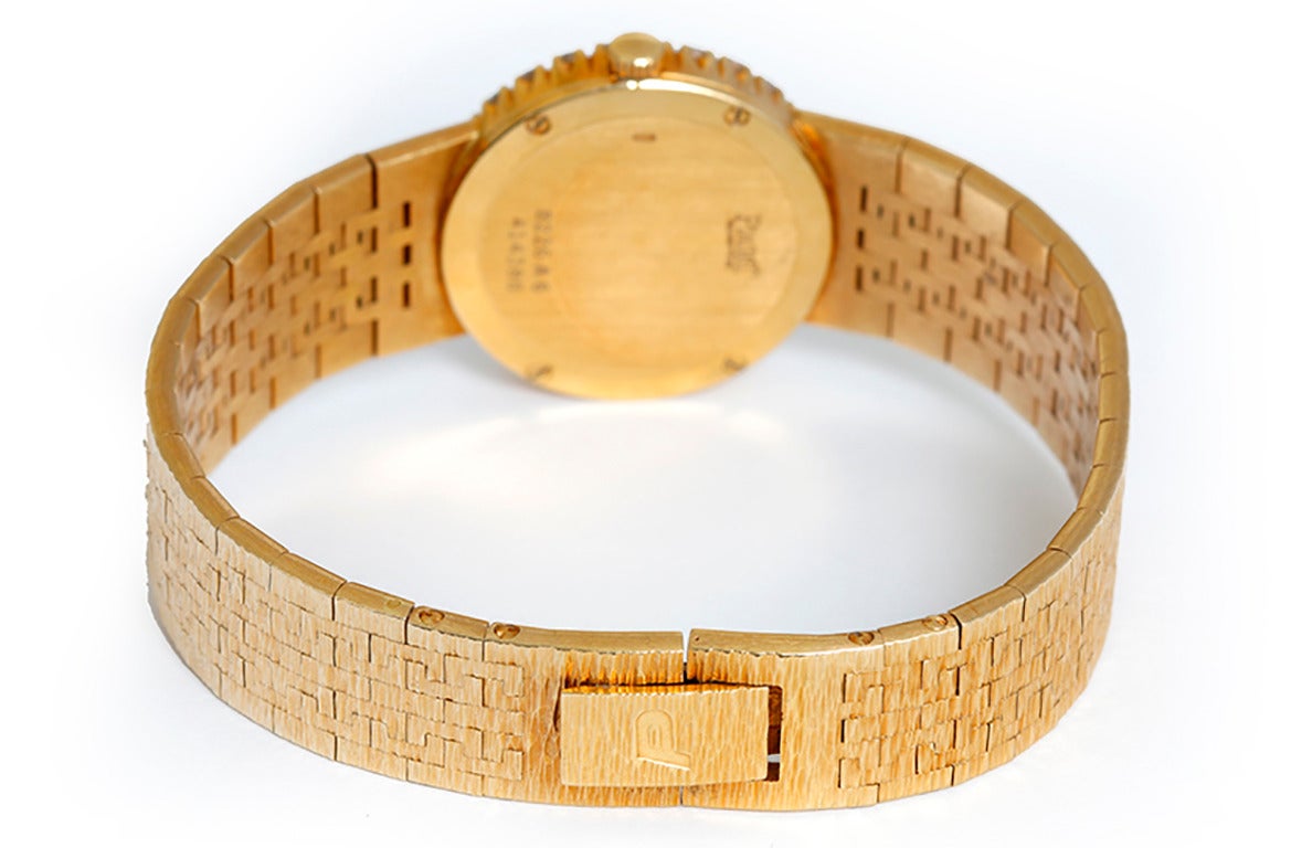 Quartz. 18k yellow gold case with diamond bezel (22mm diameter). Pave diamond dial. 18k yellow gold integrated mesh bracelet (will fit 5-3/4-inch wrist). Pre-owned with custom box.