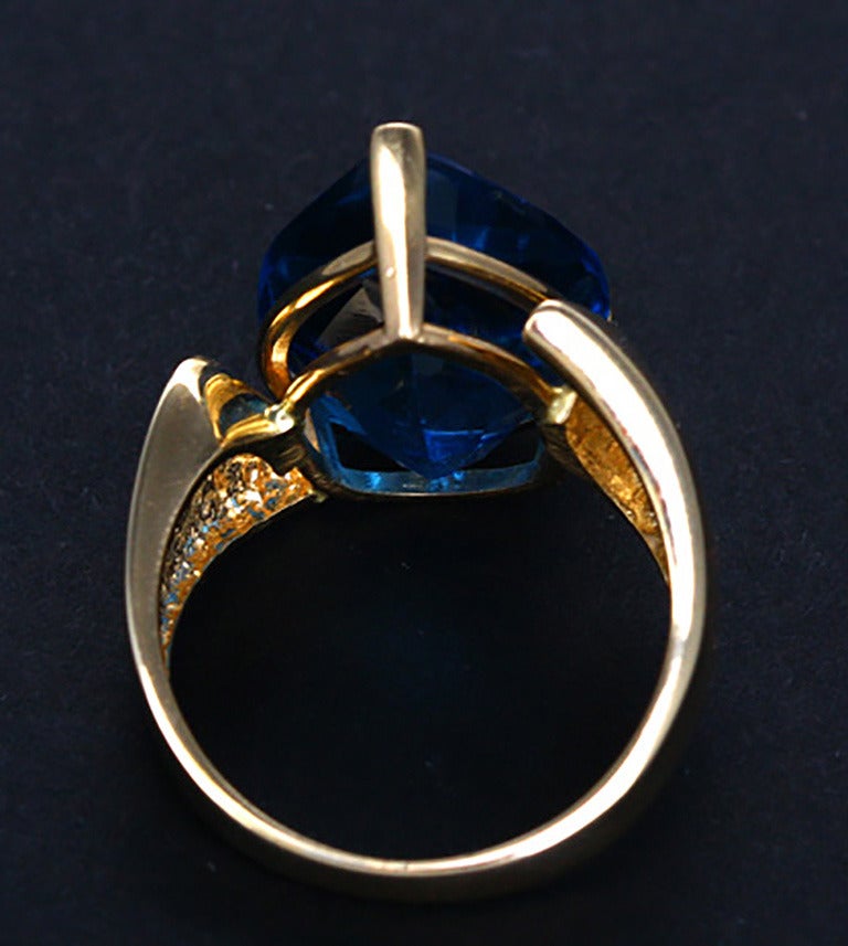 This ring is quite a statement and the blue quartz is well over 10 carats. It is a contemporary style and very popular today. It weighs 9.7 grams of 14K and is a size 8.5.
