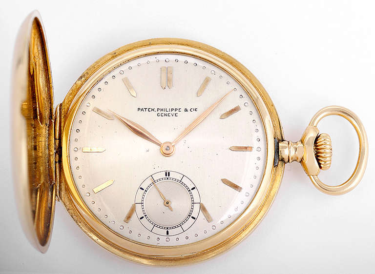 Manual-wind movement. 18k yellow gold hunting case. Inside back engraved, 48mm. Silvered dial with applied gold baton indexes, subsidiary seconds. Circa 1915. Movement number 191497. 

Dial, case and movement signed Patek Philippe.