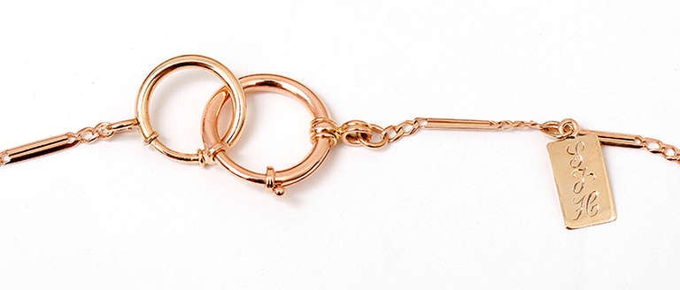 Vintage 14 rose gold pocket watch chain measuring 22 inches in length and weighing 20 grams. There is a small gold tag engraved with 3 initials that could be removed. Vintage pocket watch chains are very popular worn as a necklace and this one would