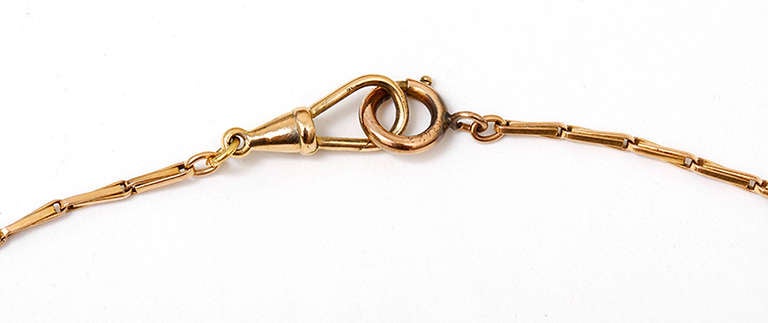 Very simple and beautiful 15-in. pocket watch chain in 14k yellow gold. It measures 15-in. in length and weighs 11.8 grams. This would be elegant worn as a necklace. Pre-owned.