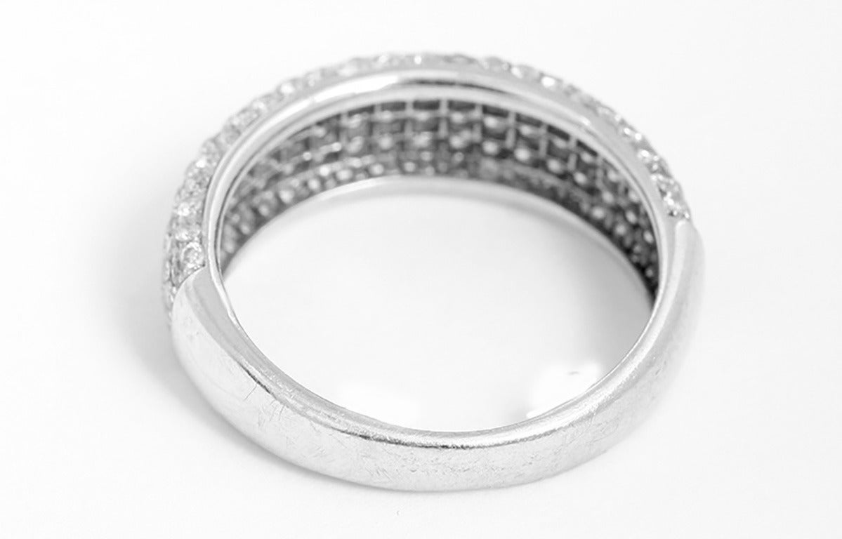 This band features diamonds apx. half way around totaling apx. 1  carat of very white diamonds. This would be a beautiful wedding band or everyday ring. It is a size 6-1/4. It has a total weight of 3.2 grams.
