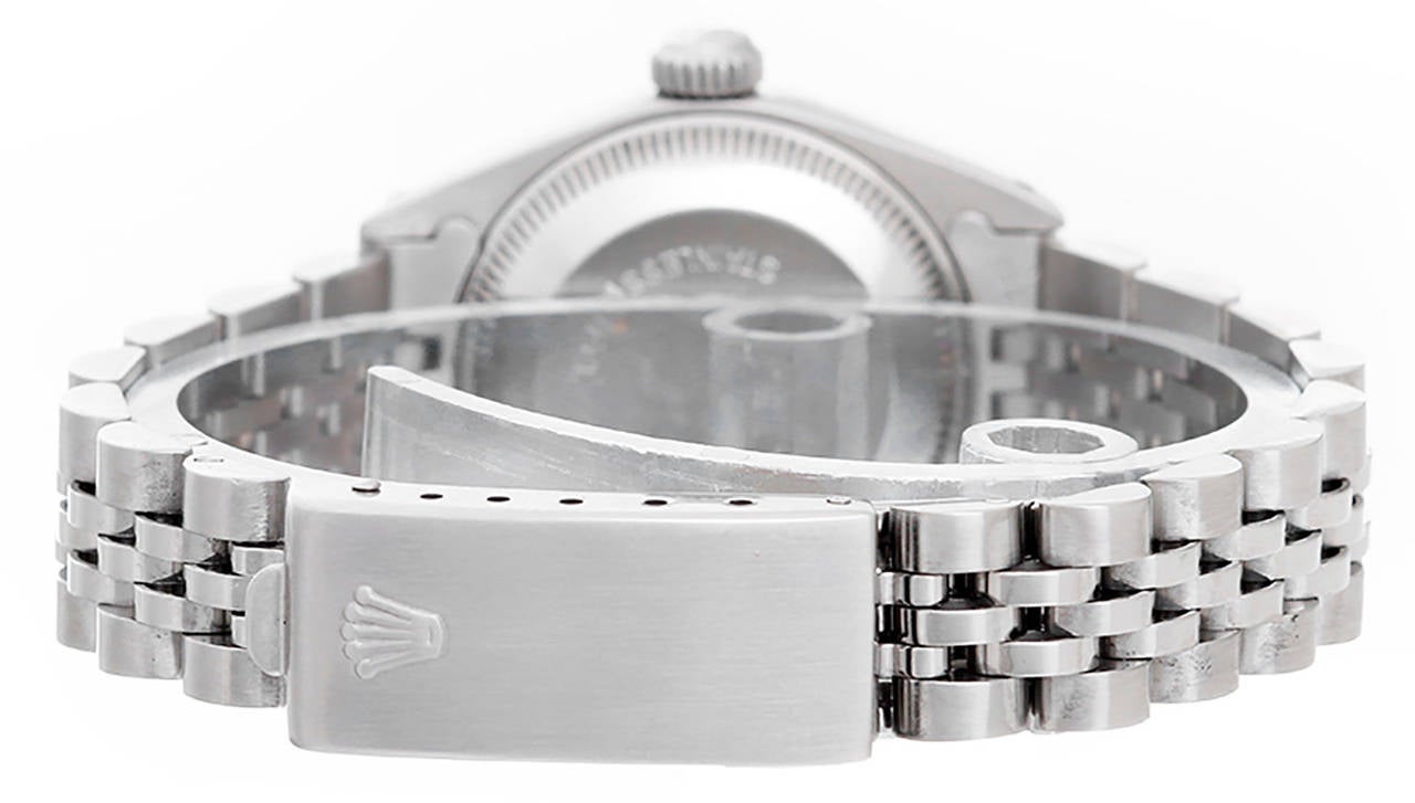 Automatic winding. Stainless steel case with 18k white gold fluted bezel (26mm diameter). Silvered dial with gold stick markers. Stainless steel Jubilee bracelet. Pre-owned with custom box.