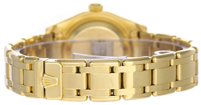 Automatic movement, 31 jewels, Quickset date, sapphire crystal, circa 1990s. 18k yellow gold case with factory diamond bezel, 29mm. Factory Rolex mother-of-pearl diamond dial. 18k yellow gold Pearlmaster bracelet. Pre-owned with box and books.