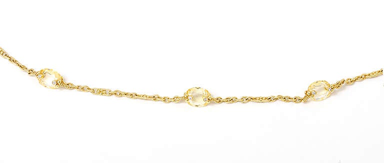 This is a beautiful Judith Ripka 18k yellow gold chain necklace that features yellow crystal-glass and diamonds. It is 32-inches long with a total weight of 43.2 grams. This unique chain necklace retails over $10,000.