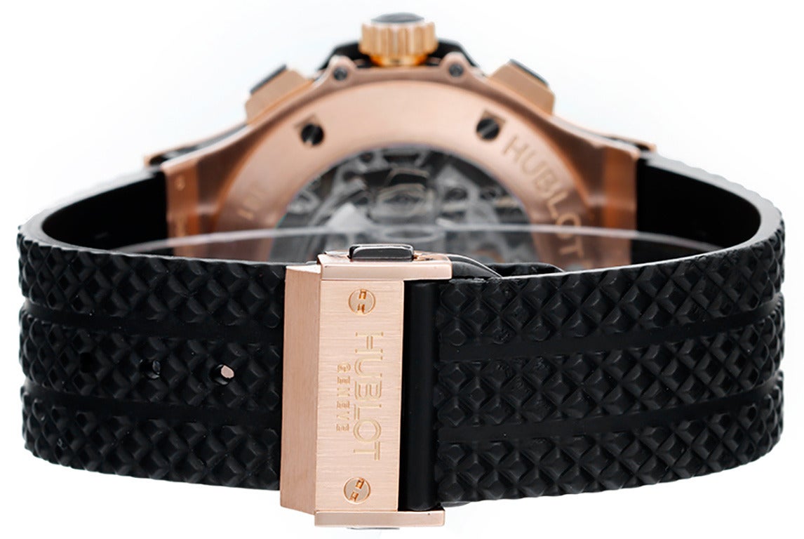 Automatic winding chronograph with date. 18k rose gold case and bezel with exposition back (44mm diameter). Black carbon fiber dial with rose gold markers; hour, minutes and seconds recorders; date between 4 & 5 o'clock. Black rubber strap band with