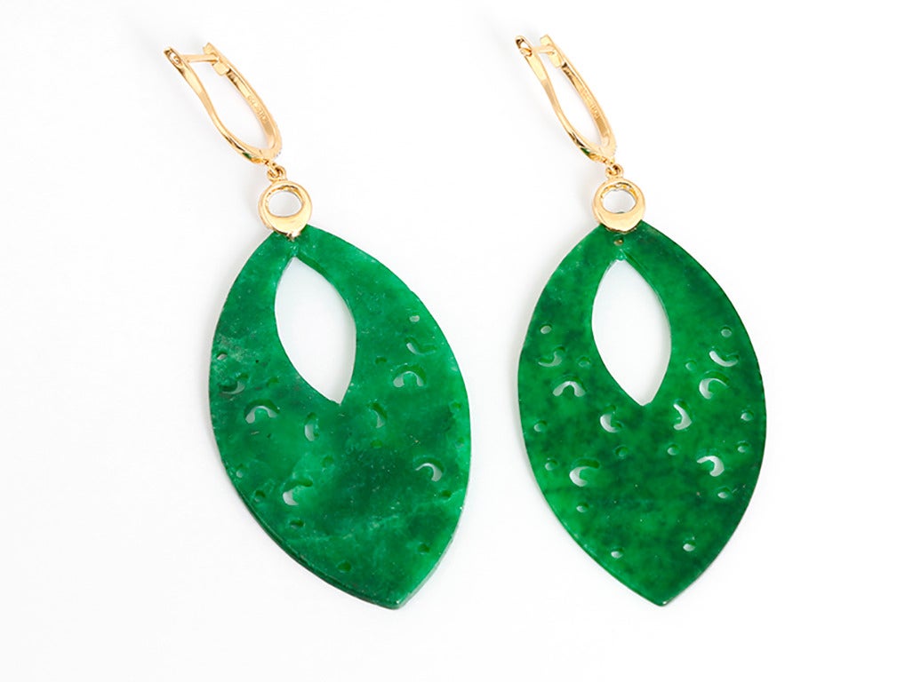 These amazing dangle earrings feature jade and apx. 0.24 carats of diamonds set in 18k yellow gold. Earrings measure apx. 2-3/4 inches in length with a total weight of 11.3 grams.