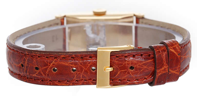 Manual-wind movement. 18k yellow gold case, 15mm x 33mm. Silvered dial with gold baton indexes. Ref. 2292/2, circa 1950s.