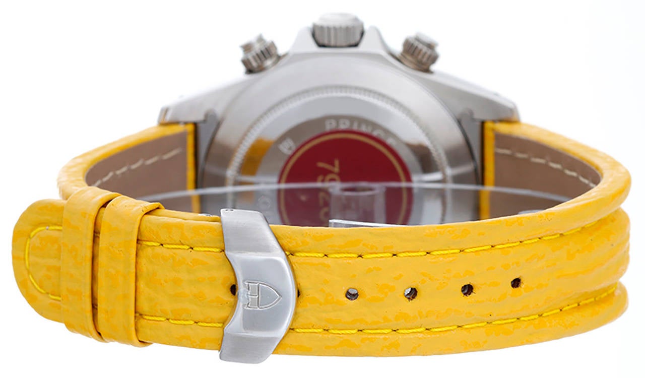 Automatic winding; chronograph. Stainless steel case with black tachymeter bezel (40mm diameter). Yellow dial with black Arabic numerals; hour, minute and seconds recorders; date at 3 o'clock position. Yellow strap band with stainless steel Tudor