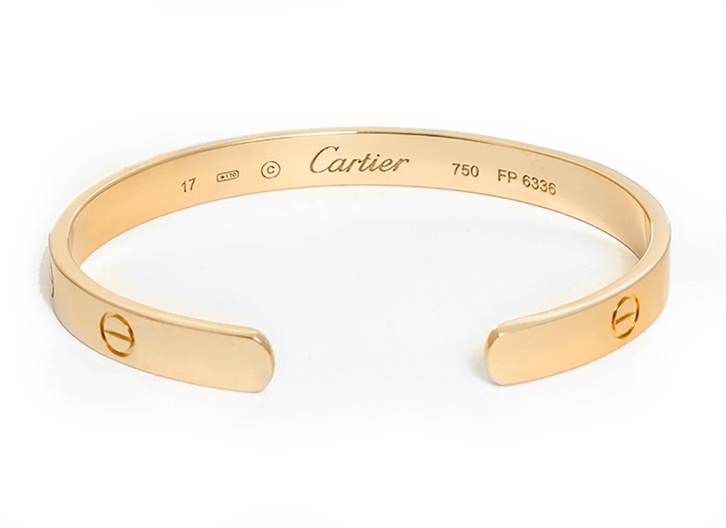 This beautiful bracelet is stamped Cartier, 17, 750  and FP 6336.  This is a great piece for everyday as well as dress. Authenticity guaranteed. Like new condition with no dings or scratches.