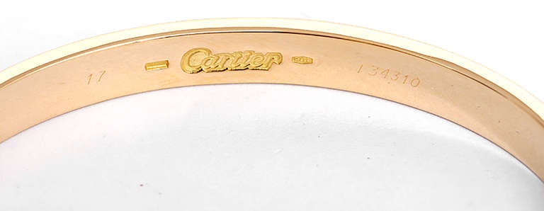 This beautiful bracelet is stamped Cartier, 17, 750  and I34310.  This is a great piece for everyday as well as dress. Authenticity guaranteed. Like new condition with no dings or scratches. Includes screwdriver and custom box.
