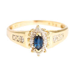 Sweet Yellow Gold and Synthetic Sapphire Ring Surrounded by Small Diamonds