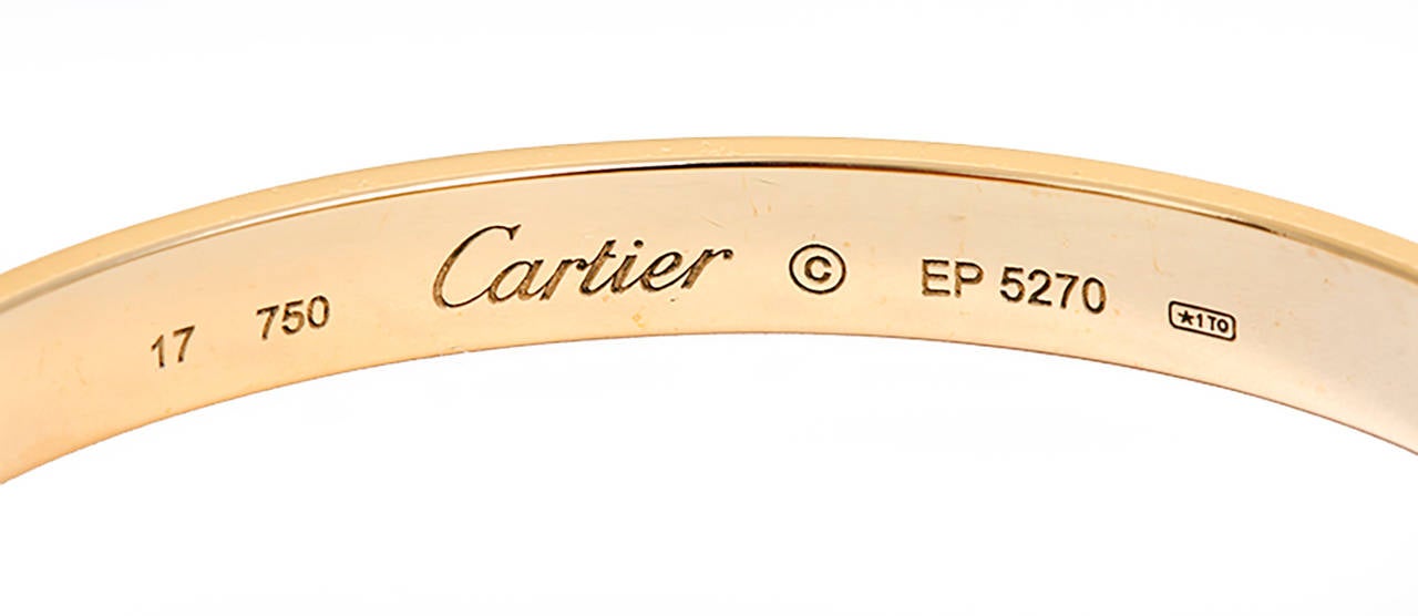 This beautiful bracelet is stamped 17, 750, Cartier, and EP 5270.  This is a great piece for everyday as well as dress. Authenticity guaranteed. Like new condition with no dings or scratches. Includes box, books, papers, and screwdriver.